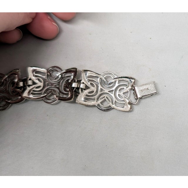 1950s Modernist rhodium plated openwork links with round domed connectors bracelet with fold over clasp. Marked "NAPIER"...