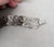 1950s Modernist rhodium plated openwork links with round domed connectors bracelet with fold over clasp. Marked "NAPIER"...