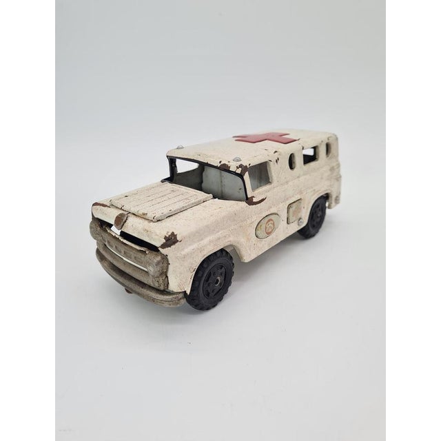Original metal toy car – ambulance/medical vehicle, made entirely of sheet metal. A classic toy from the mid-20th century,...