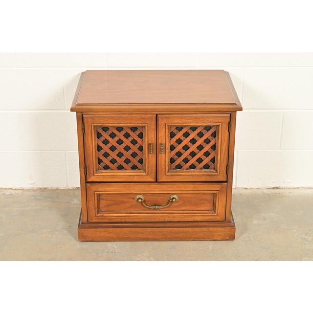 A gorgeous Spanish Colonial style nightstand By Drexel, "Esperanto Collection" USA, 1960s Carved walnut, with original...
