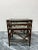 Set of three mid-century dark stained rattan pole and glass top nesting tables. Dimensions: Small - W20.25" D16.25"...