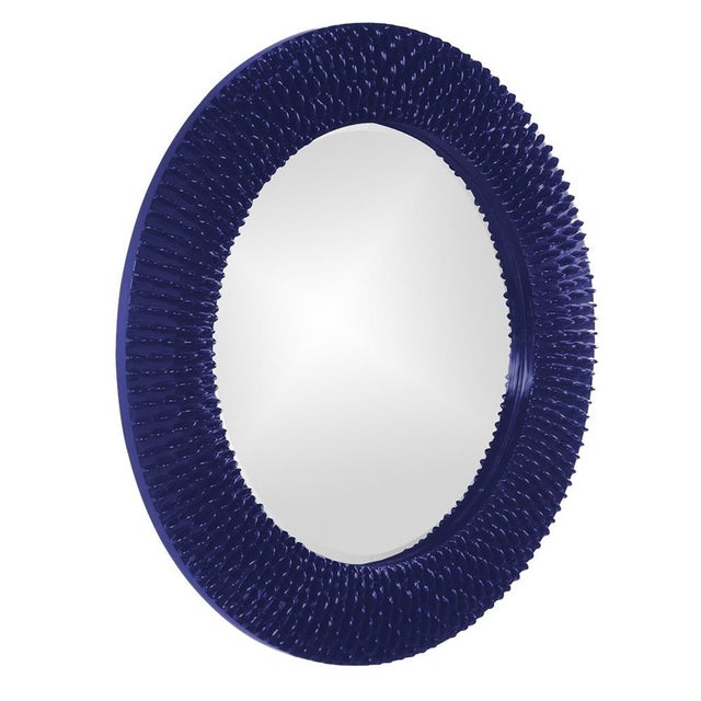 Bergman features a round frame characterized by a textured ribbed frame. It is then painted with our custom glossy navy...