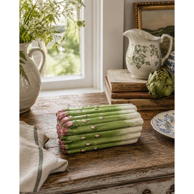 A charming Fitz and Floyd covered box modeled as a tightly gathered bundle of asparagus. The dimensional stalks are...