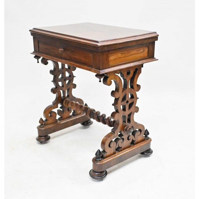 Elegant early Victorian games table with barley twist stretcher Rosewood games table with a chest board and back gammon...