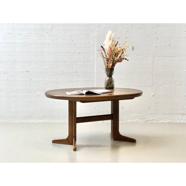This distinctive dining table combines clean, organically shaped lines with functional sophistication and is a beautiful...