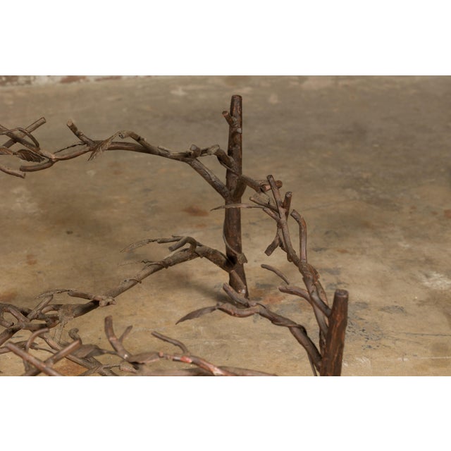 This French iron twig coffee table base from the mid-20th century is a remarkable fusion of natural inspiration and...