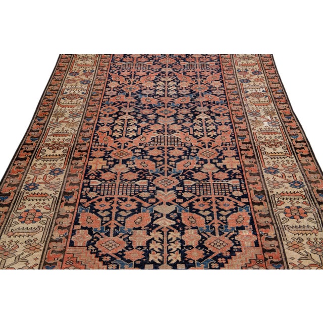 Beautiful antique Malayer hand-knotted wool rug with a navy blue field. This Malayer piece has a beige with rust and brown...