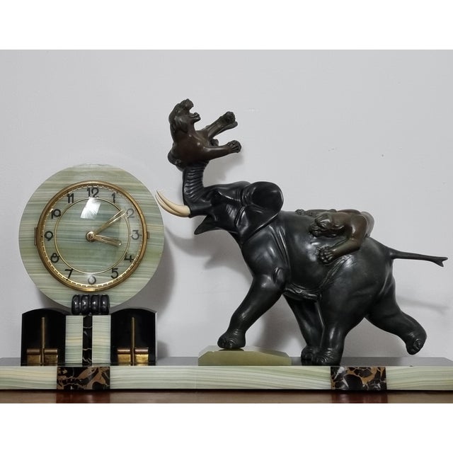 A magnificent Art Deco clock featuring an impressive sculpture in the Japanese Meiji style, depicting two tigers in mid-...