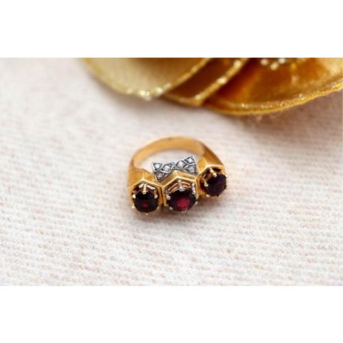 Gold ring with diamond flakes (12) and three cut garnets. Metal: Gold. Origin: Portuguese. Brand: Dragon and rooster's...
