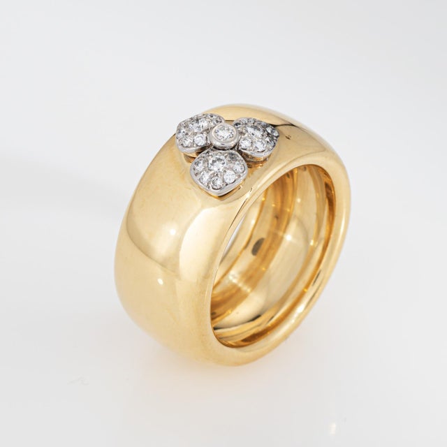 Vintage Tiffany & Co diamond flower ring crafted in 18 karat yellow gold & platinum (circa 2000). Round cut diamonds total...