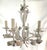 Precious metal tole chandelier from the late 20th century. This piece has six lights and has been recently painted in a...