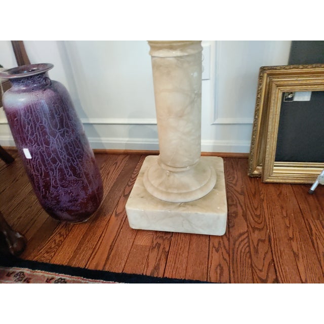 A beautiful marble pedestal with nice veining through out shaft. Very heavy 6 inch width shaft 42 inches tall Top marble...