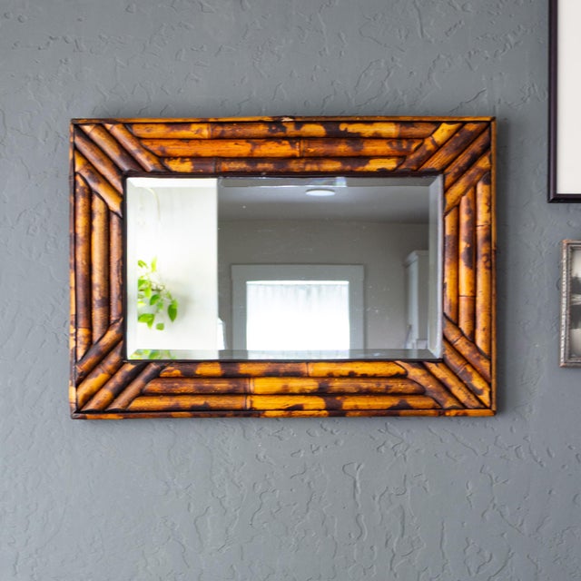 This vintage bamboo mirror has been burnt in the traditional Victorian manner to create a mottled, faux tortoise-shell...