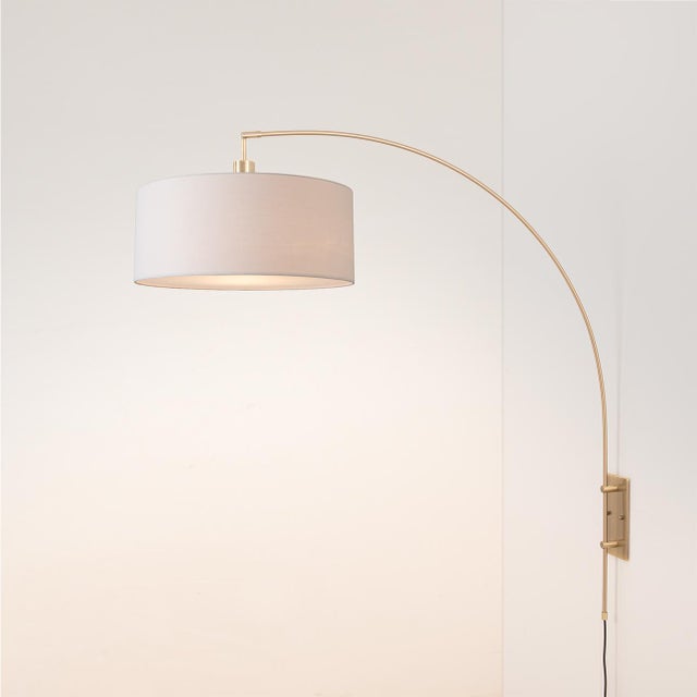 The Span Wall Mounted Arc Lamp is a Modern lighting masterpiece designed by Peter Morelli in 1960. This elegant wall-...