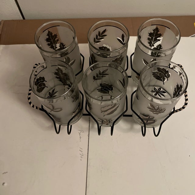 Libbey stamped L on bottom silver foil tumbler glasses with black and white carrier /server, six tumblers with one carrier