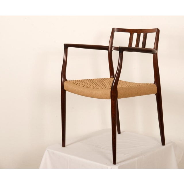 Solid hard wood frame, Model 64 armchairs, designed in 1966 by Niels Moller for his own workshop: J.L. Moller Mobelfabrik...