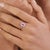 This Art Deco-style ring features a 0.8 ct emerald-cut pink sapphire, set in 14k white gold. The center stone measures 6.5...