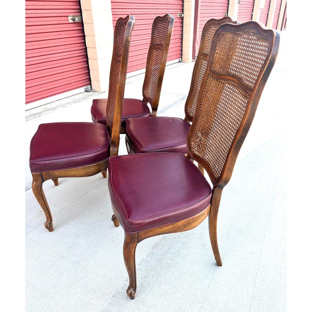 Set of 4 French Provincial Cane Back, Leather Seats Dining Chairs. Red leather seats, curved legs. If you don't like red...