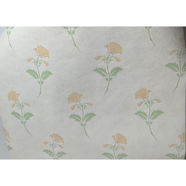 Ready-trimmed Osborne & Little wallpaper with a washable surface. The base is an off-white color, and there are floral...