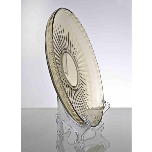 Vintage Art Glass Plate realized in Italy in 1970. Transparent beige with yellow nuances Very good condition.