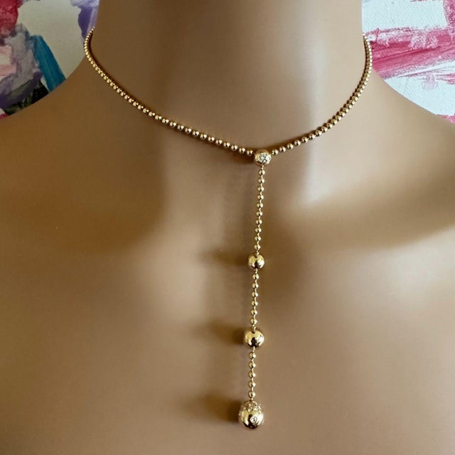 About This Piece: The Cartier Draperie de Decollate necklace exudes timeless elegance. Crafted from 18k yellow gold, its...