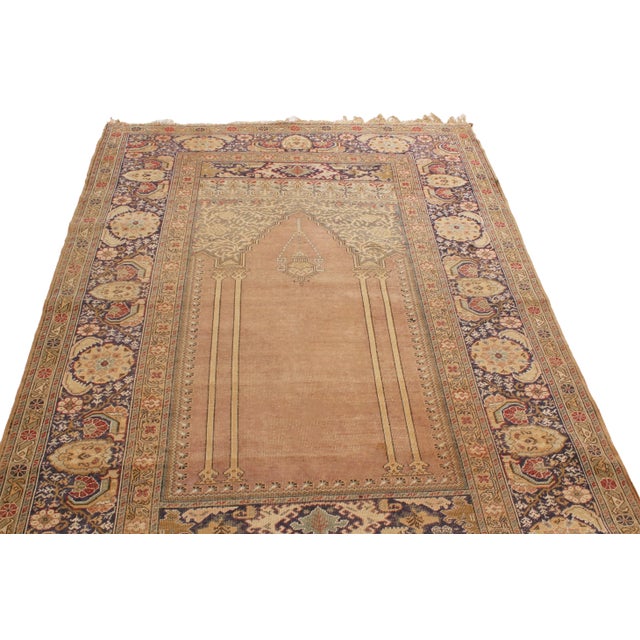 Enjoying hand-knotted wool originating from Turkey in 1900, this turn of the century antique Kayseri rug utilizes one of...