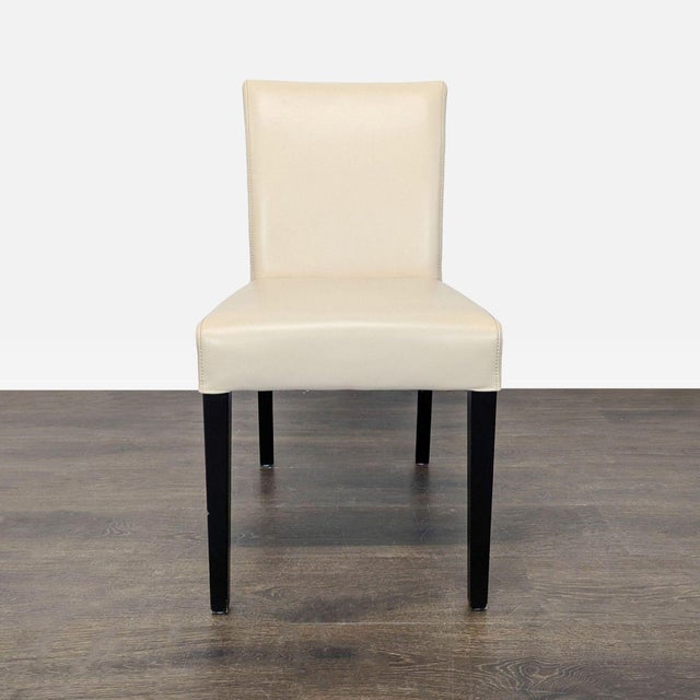 Riverstone leather in ivory with ebony wood legs. Brand: Crate & Barrel. Original Price: $2394. Dimensions (in): 18W x 20D...
