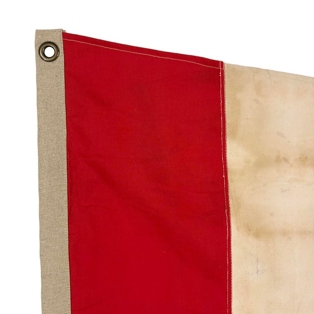 This nautical-style pennant is fully sewn from a cotton cloth salvaged from another vintage signal flag. All striped seams...