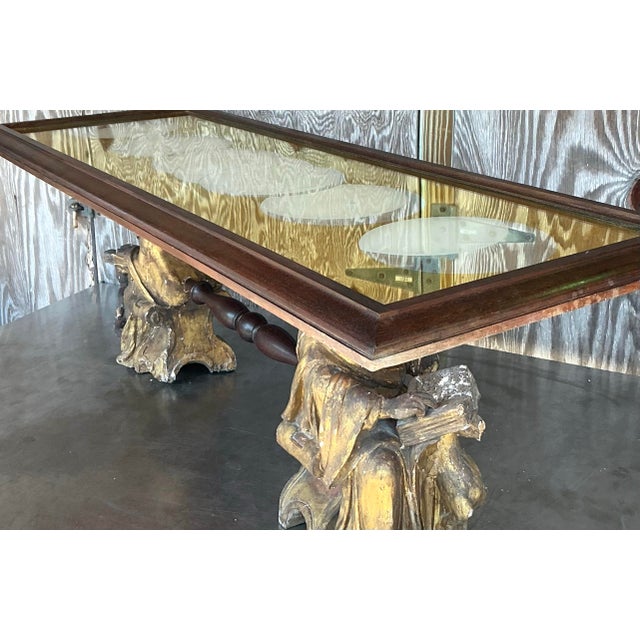 This breathtaking vintage carved angel coffee table is a one-of-a-kind statement piece, blending rustic charm with...