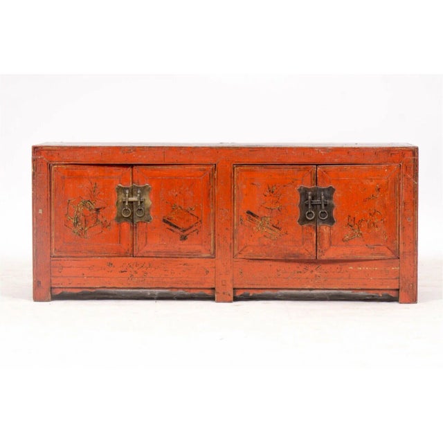 A 19th century red lacquered Chinese trunk or low chest with brass hardware. This is a 19th century antique Chinese trunk...