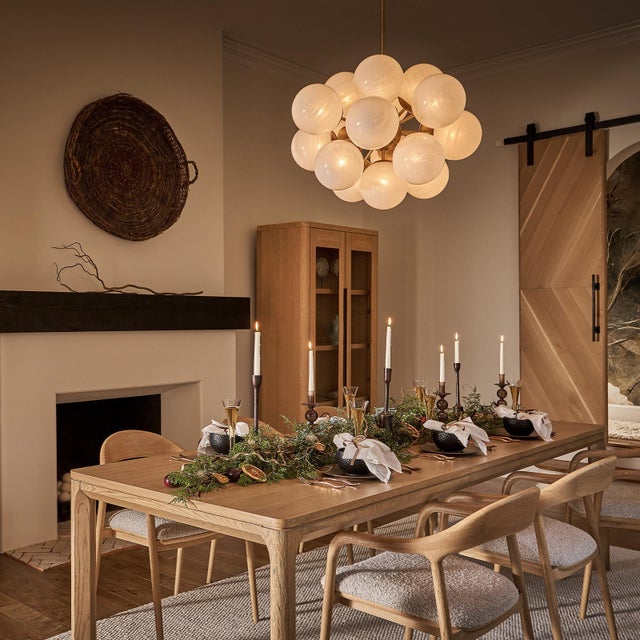 The Shine Chandelier is a beacon of joy, evoking the whimsy of a cluster of balloons with a nod to mid-century modern...