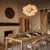 The Shine Chandelier is a beacon of joy, evoking the whimsy of a cluster of balloons with a nod to mid-century modern...