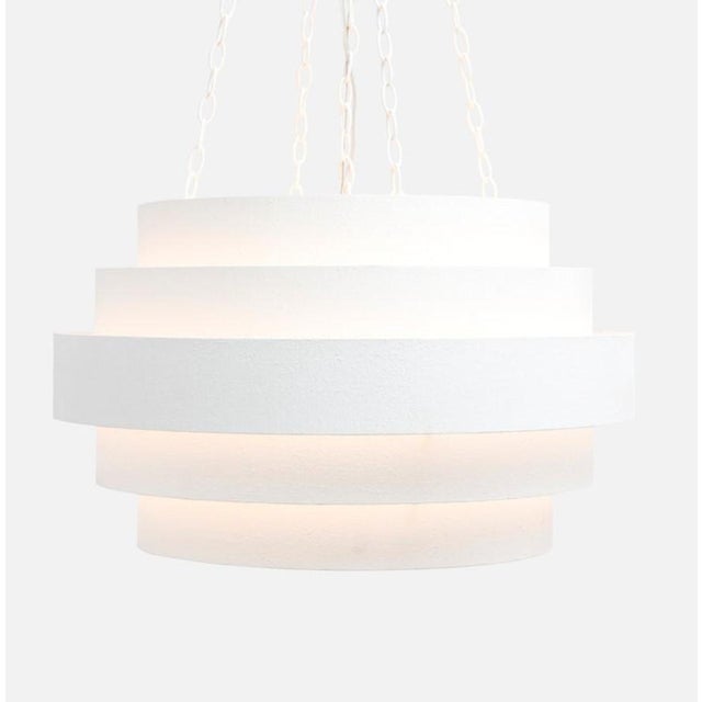The Made Goods Thyra Chandelier is a stunning lighting fixture that combines luxurious design with modern elegance....