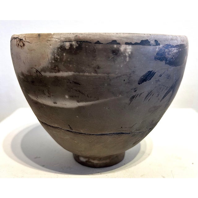 Contemporary interiors round pedestal with texture with hints of bamboo leaf design