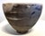 Contemporary interiors round pedestal with texture with hints of bamboo leaf design