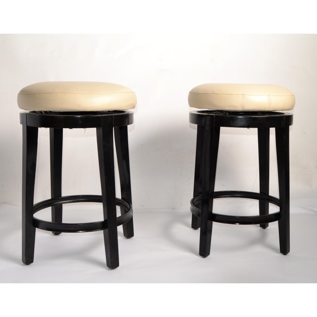 Pair of Vintage 24 Inch Height swivel Kitchen, Wine or Low Stools in black finished Wood with Tan - Beige Faux Leather...
