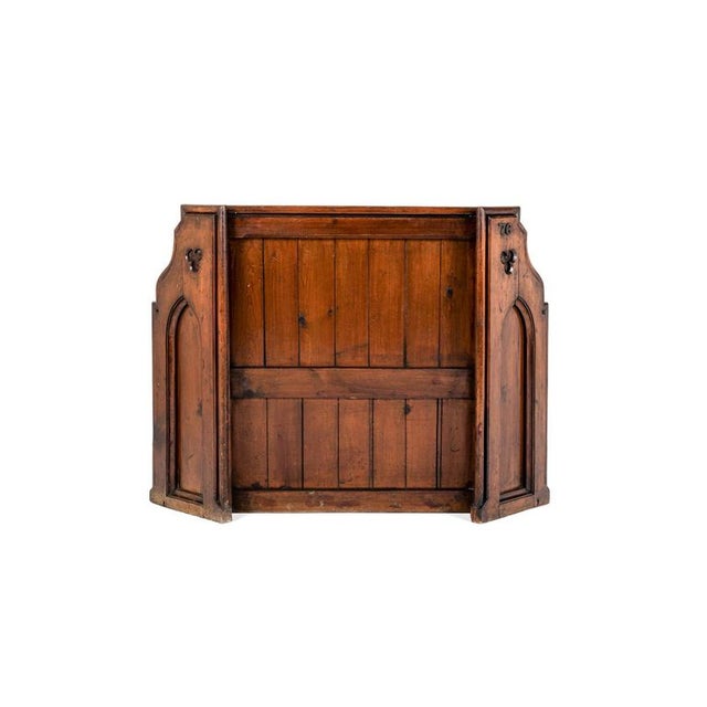 A superb pitch pine chapel pew with a high panelled back with tongue and groove panels and a moulded top rail. The pew has...