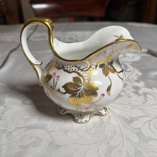 4.75” high 6” long (spout to handle) 3” deep. Some crazing.