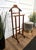 Vintage 1970s Italian wood dressboy valet stand, with classic carved column and pedestals completed by the fine and...