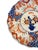Beautiful 18th century Japanese Imari plate. Design features a hand-painted floral arrangement in a blue vase.