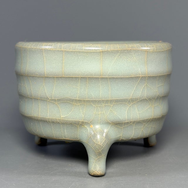 Antique Chinese Longquan celadon tripod censer with spiral ribs on the body. Natural crackle glaze. Carefully cleaned...