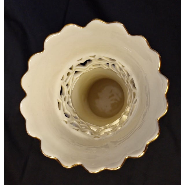 Lenox Pierced Heart Vase. A collectible piece featuring delicate interlocking heart cutouts and 24k gold trim accents. A...