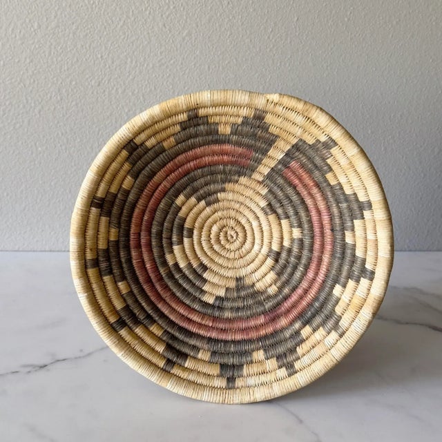 Small vintage woven coil basket with star motif, in the manner of Navajo wedding ceremonial baskets.