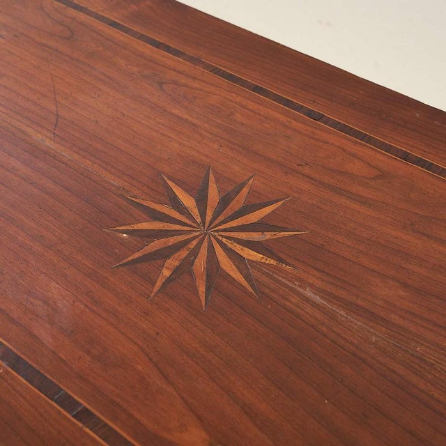 Item : discover the timeless elegance of this inlaid wood table, a piece that combines functionality and refined design....