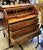 This elegant French-style roll-top secretary desk combines refined European craftsmanship with exceptional functionality....