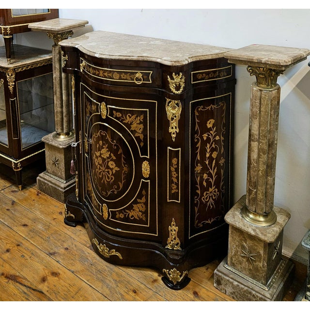 Elevate your interior with this stunning French-style marquetry cabinet, masterfully crafted with intricate floral inlay...