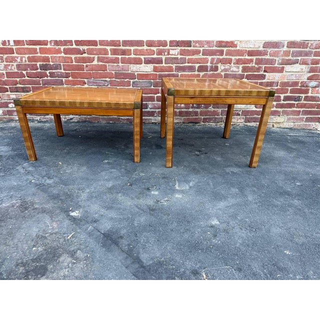 Pair of campaign-style accent tables from the Drexel Accolade Collection Featuring golden wood finish and distinctive...