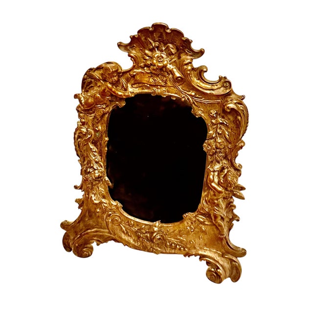 A beautifully cast antique French bronze picture frame dating to the late nineteenth century. This elegant frame has a...