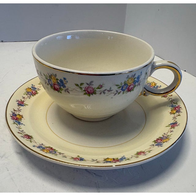 This refined set of three vintage teacups and saucers was produced by Crown Potteries Co. in the United States circa the...