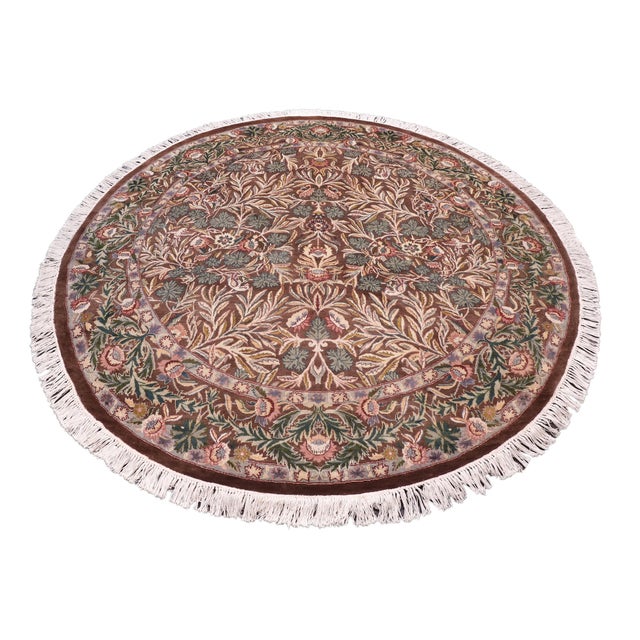 This hand‑knotted Pak Persian round rug showcases the finest expression of traditional Persian artistry. Each piece is...